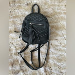 Leather mini quilted pattern backpack/bag.